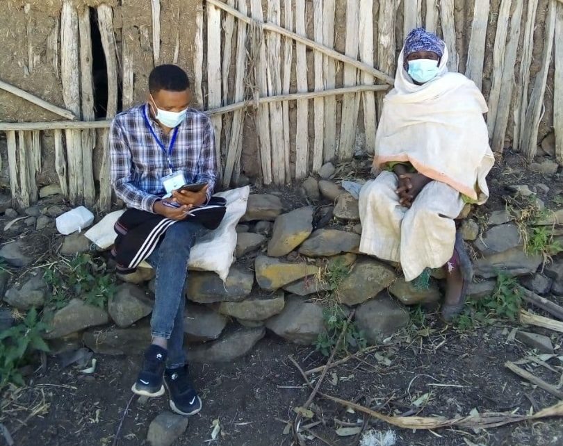 An enumerator interviews a participant for an impact evaluation in Ethiopia
